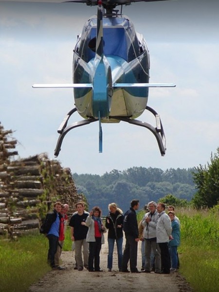 Focus on the Land Rover and helicopter